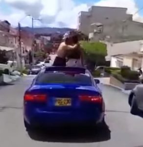 Jaguar driver was "shot" by the panoramic, minutes before two young people danced on the sunroof
